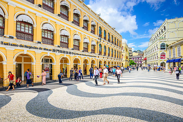 Macau, China - May 21, 2014: People enjoy Senado Square. The territory was the last European colony in Asia and the architecture is inspired by the former Portuguese rule.